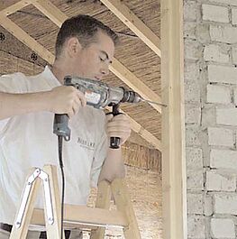 Drill through the wall connection into the wall in a distance of about 70 cm