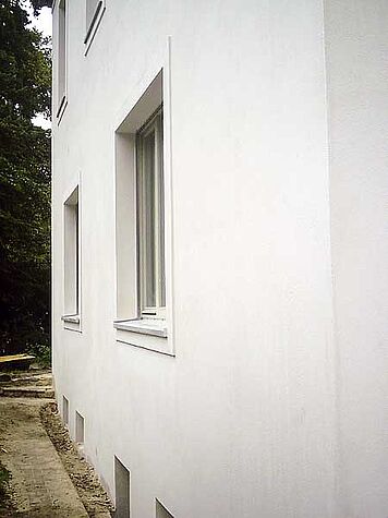 Detail of a window of the plastered house…,