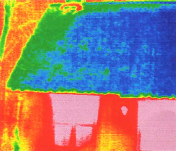 The reason could be found with a thermal image camera and the blower door test: A hole in the vapour barrier of the chimney caused vapour convection.